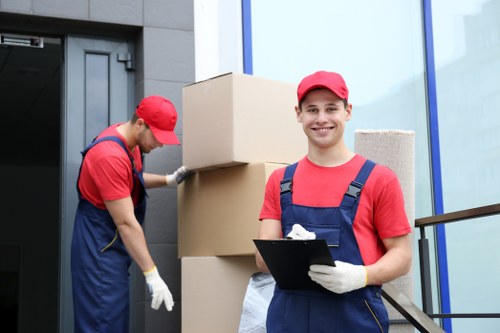 Loading furniture into a van for transport across London