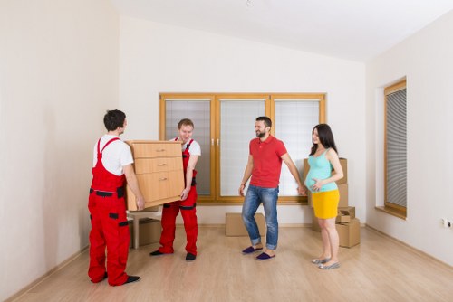 Moving truck arranged for a London home move with boxes and furniture