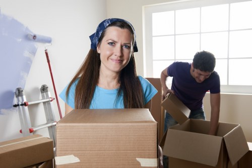 Careful loading of boxes and furniture into a moving van in London