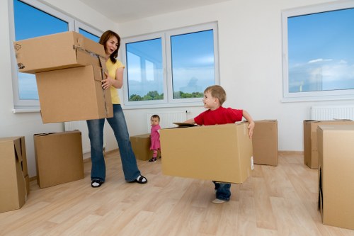 Removal crew loading items into a van for a London move