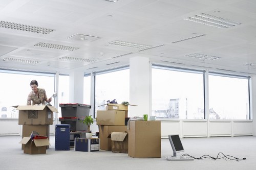 Local moving team handling furniture and boxes in London