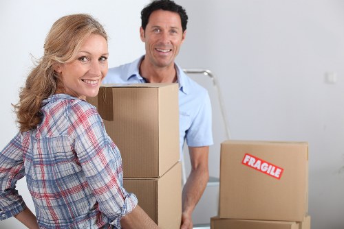 Packed boxes and furniture loaded into a van