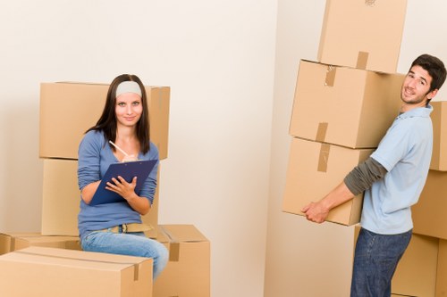 Packed moving boxes and household items ready for transport in London